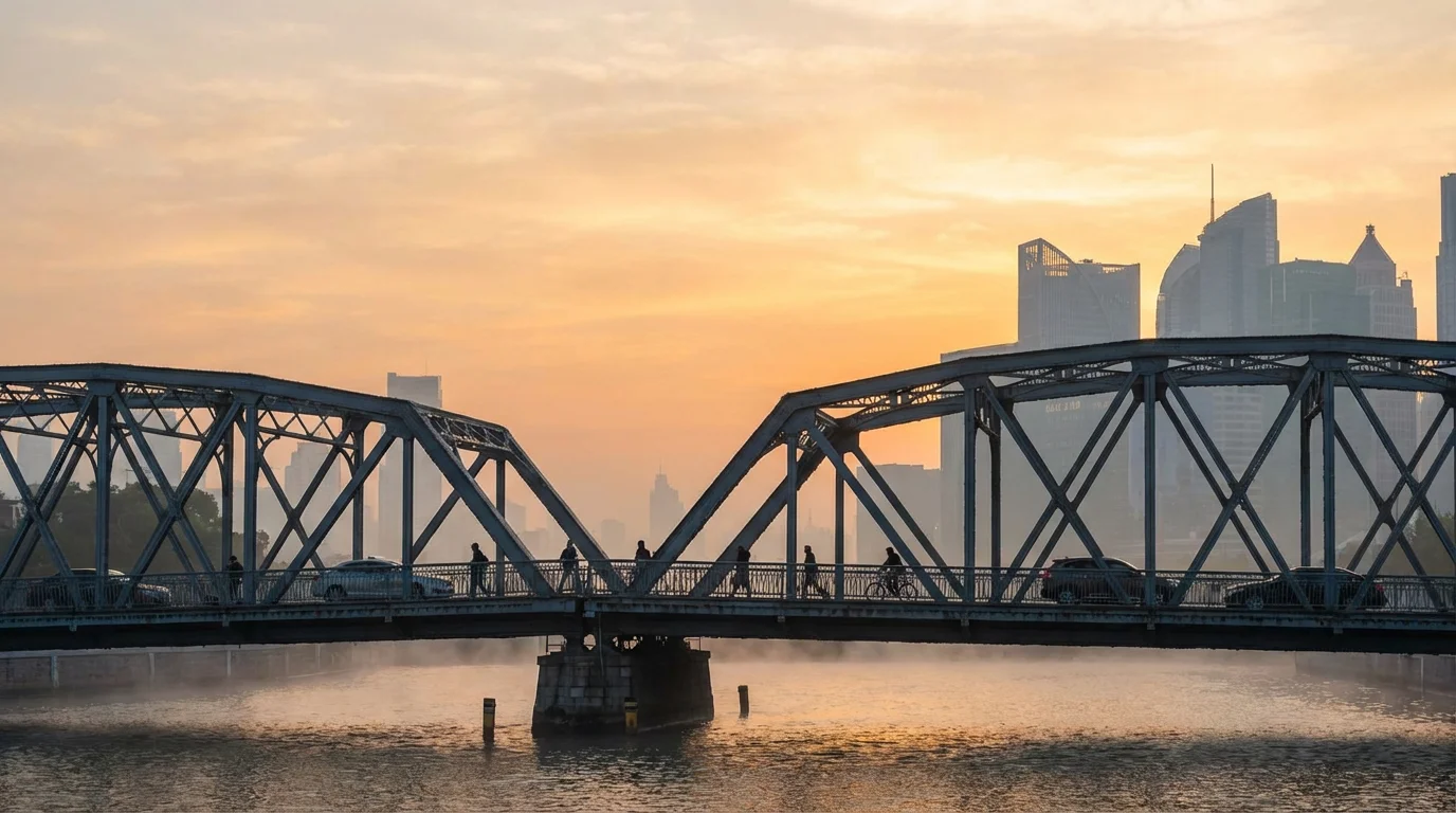 A calm sunrise over a city bridge as people begin their workday.